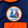2e208d09-e87b-497c-b71a-0bae39a77117 Guardapolvo y bolsita - Uniforme Jardín Emaús - Sala naranja.